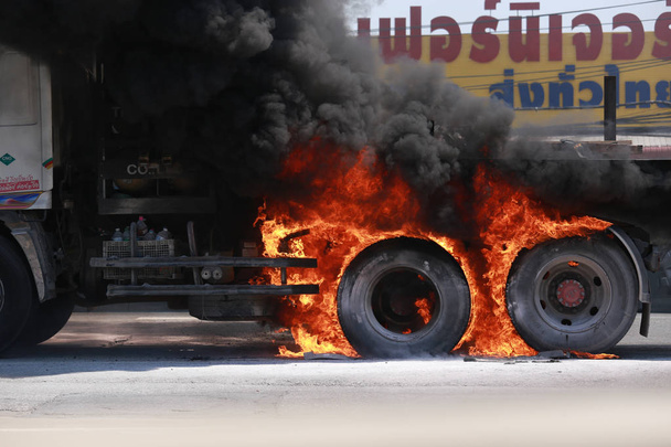 Bangyai, Thailand- March 12th, 2019: Truck on fire on the back of engine. Fire burnt tires in danger and heat ill destroy fuel. - Photo, Image