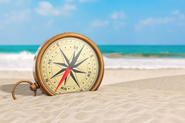 Glossy Bronze Vintage Compass with Windrose on an Ocean Deserted - Photo, image