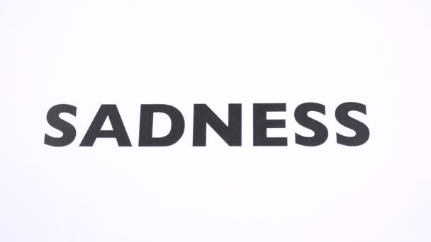 SADNESS prohibition symbol, refuse gloom, unhappiness ban writing copy space. No depression, reject dreariness, misery, grief, sad negative sign with white background. Concept of happiness and joy - Footage, Video