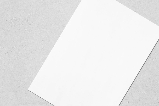 Close up of empty white rectangle poster mockup lying diagonally - Valokuva, kuva