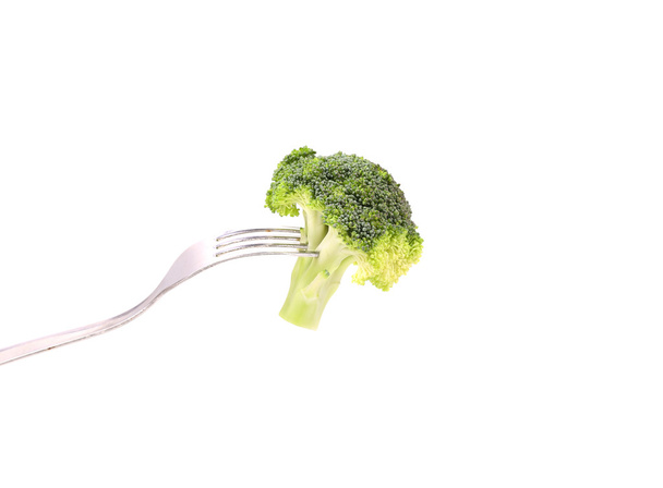 Fresh broccoli on a fork. - Foto, afbeelding