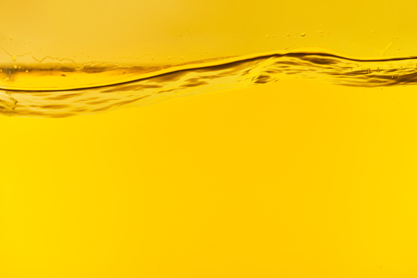 wavy clear fresh water on yellow bright background - Photo, Image