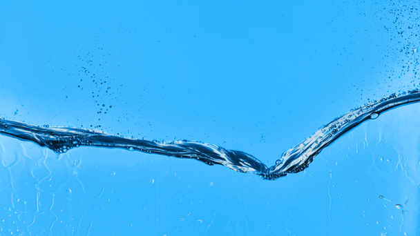 eau ondulée sur fond bleu avec des gouttelettes
 - Photo, image