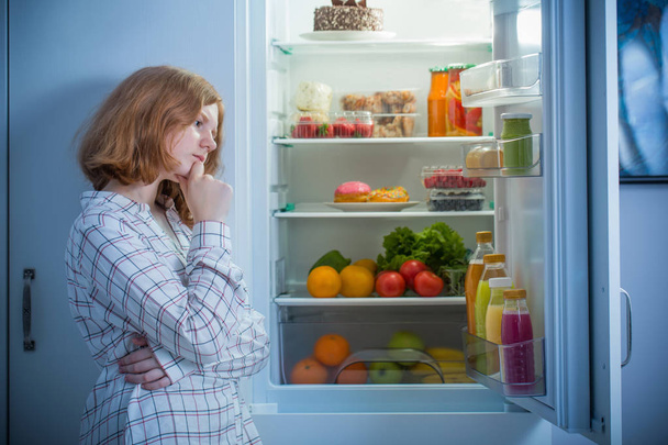 teenager girl at fridge with food - Foto, Imagen