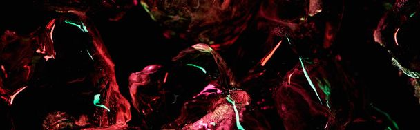 panoramic shot of clear ice cubes with red and green light isolated on black - Fotografie, Obrázek