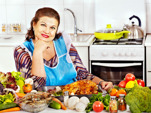 Mature woman preparing at kitchen. - Photo, Image