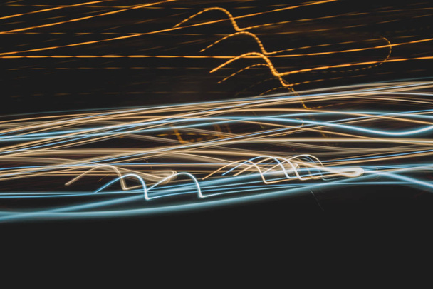 Abstract bright blurred neon trend background, multi-colored lines. Speed light beam night traffic and lights. - 写真・画像