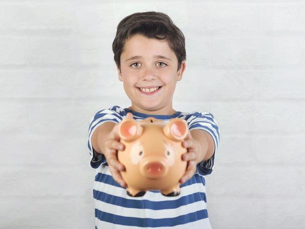 funny child with piggy bank - Foto, Bild
