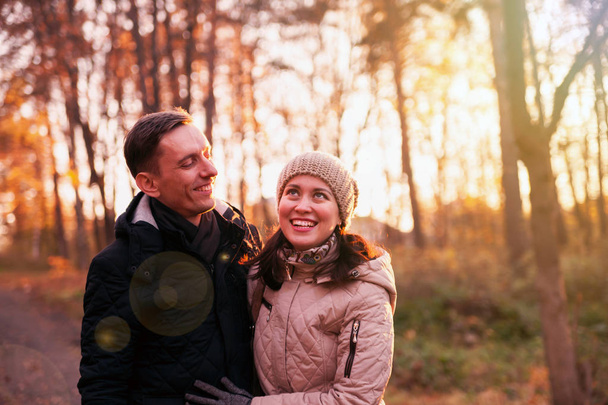 Portrait of   woman and   man on   walk in   autumn forest - Foto, Bild