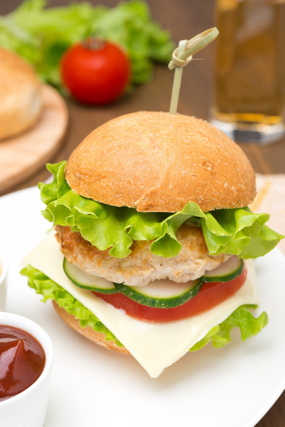 homemade chicken burger with ketchup and mustard on a plate - Foto, Imagen
