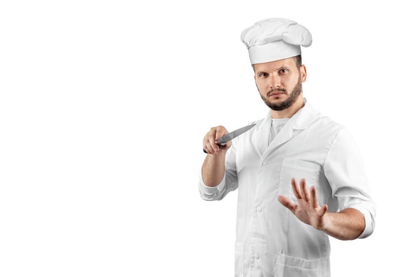 A man with a beard, a cook in a hat and a knife in his hand Isolated on a white background. Cooking, recipes, cuisine. - Foto, afbeelding