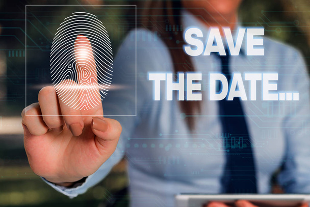Writing note showing Save The Date. Business photo showcasing Organizing events well make day special event organizers Woman wear formal work suit presenting presentation using smart device. - Photo, Image