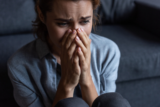 upset woman crying and covering face at home  - Photo, Image