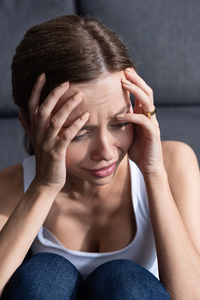 depressed young woman with ring crying at home - Foto, Bild