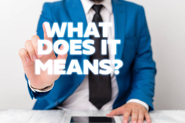 Handwriting text writing What Does It Means question. Concept meaning asking someone about meaning something said and you do not understand Businessman with pointing finger in front of him. - Photo, Image