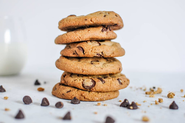Wide selective closeup shot of a stack of baked chocolate cookies - Zdjęcie, obraz
