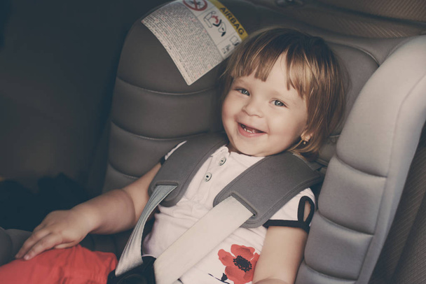   toddler girl in car seat - Foto, imagen
