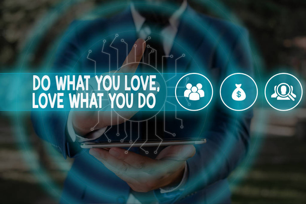 Handwriting text Do What You Love Love What You Do. Concept meaning Pursue your dreams or passions in life Male human wear formal work suit presenting presentation using smart device. - Photo, Image