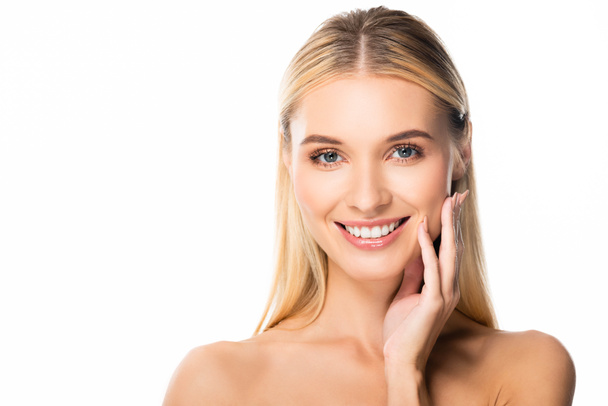 naked smiling blonde woman with white teeth touching face isolated on white - Fotoğraf, Görsel