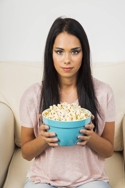 Girl with her popcorn - Фото, изображение