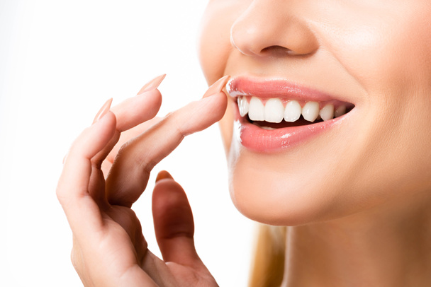 vista parziale di donna con denti bianchi isolati su bianco
 - Foto, immagini