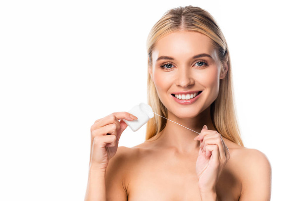 smiling naked woman holding dental floss isolated on white - Photo, image
