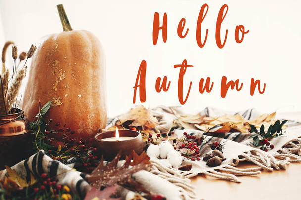 Hello Autumn text, fall greeting sign on pumpkin and candle with - Photo, Image