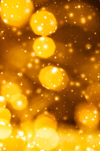 Glamorous gold shiny glow and glitter, luxury holiday background - Photo, Image