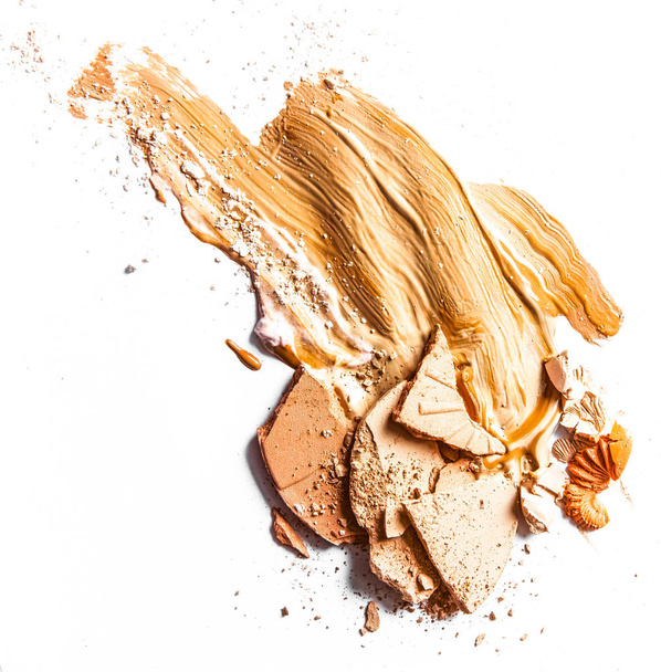Crushed eyeshadow, powder and liquid foundation close-up isolate - 写真・画像