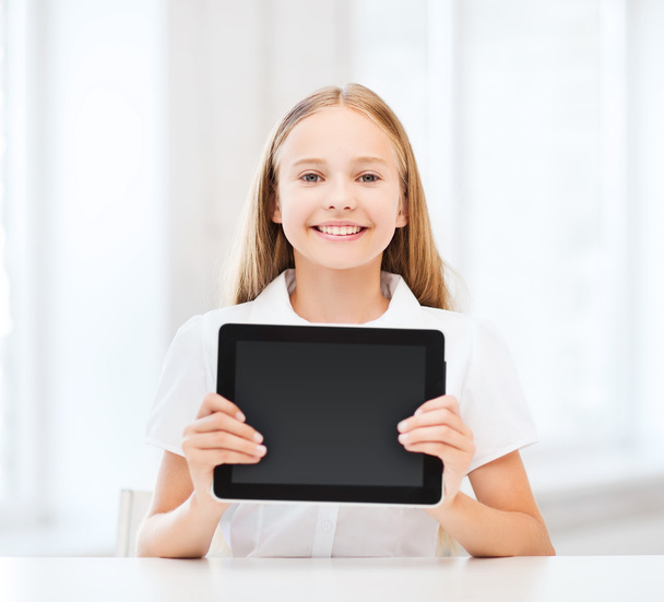 Girl with tablet pc at school - Foto, afbeelding