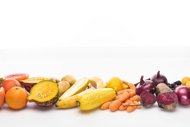 carrots, red onions, beetroots, zucchini, oranges and pumpkin on white background - Foto, afbeelding