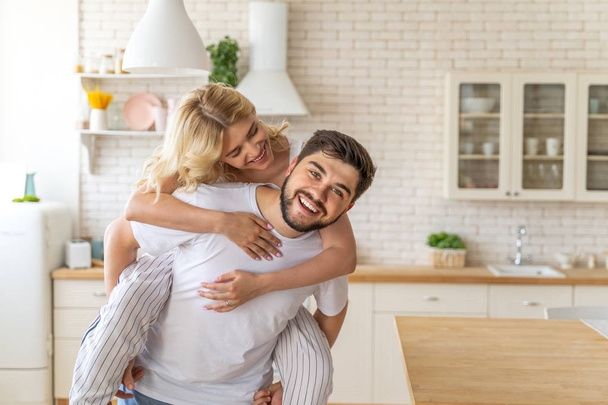 Pretty young woman is hugging smiling man - Photo, image