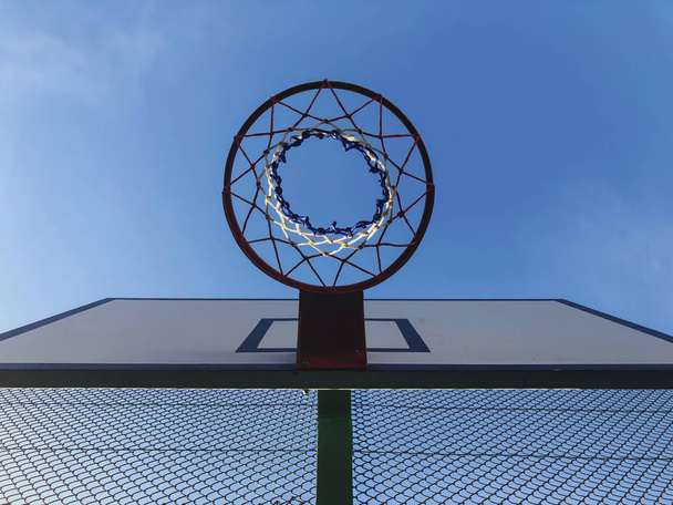 Basketball basket and board on the blue sky background - Fotó, kép