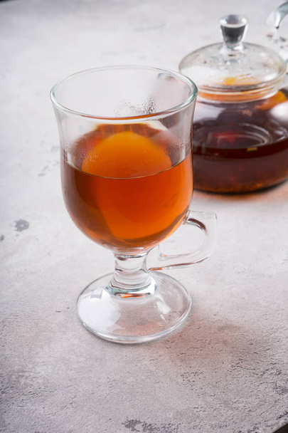 Transparent glass tea cup with teapot - Fotó, kép