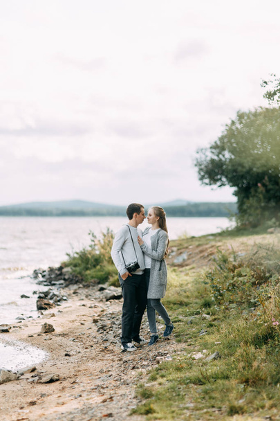 travel walk in the woods. young couple walking on the lake.  - Fotoğraf, Görsel