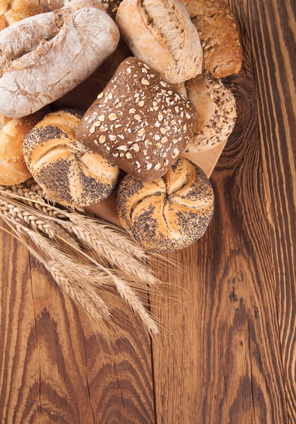 Fresh bread on wood - Photo, Image