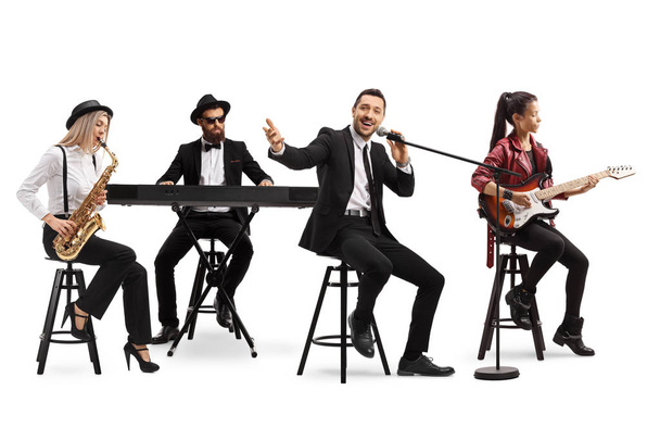 Music band with a guitarist, sax and keyboard and a singer  - Foto, imagen