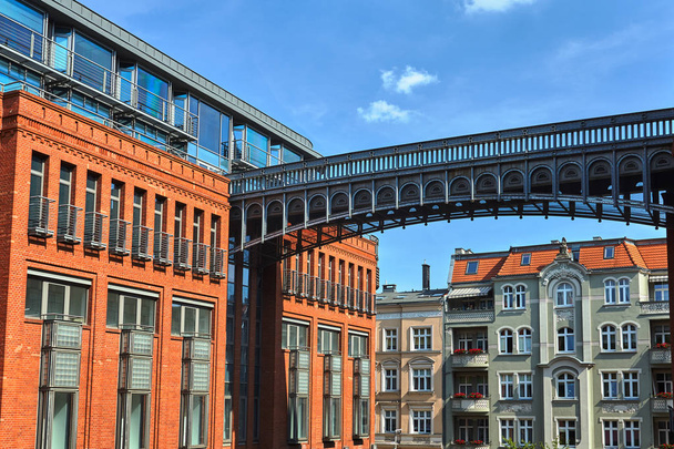 metal footbridge and Red brick wall in an old brewery in Poznan - Photo, Image