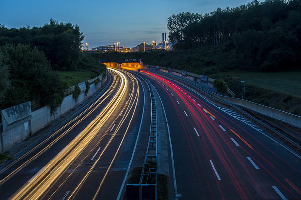 Long time exposure freeway cruising car light trails streaks of light speed highway tunnel - Photo, Image