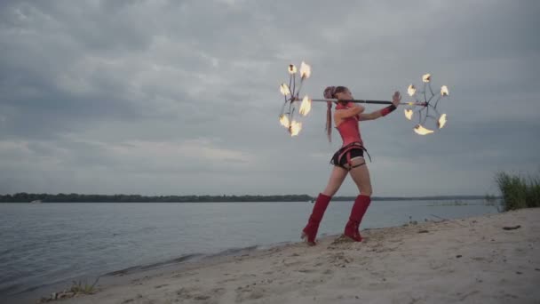 Girl with fire by the river - Footage, Video