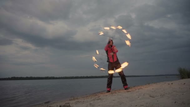 A man with fire on the river - Footage, Video