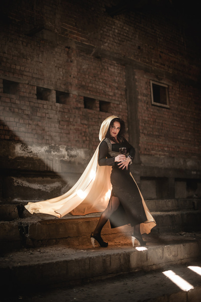 Posing woman with a white mantle - Fotografie, Obrázek
