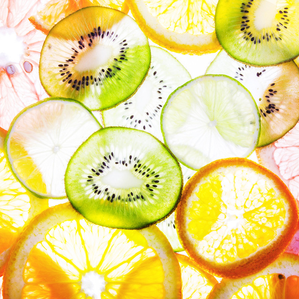 Sliced citrus fruits background - Foto, Imagen