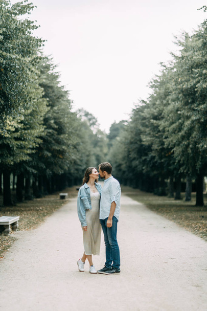  love story in Berlin. couple walking on alley in Park - Photo, Image