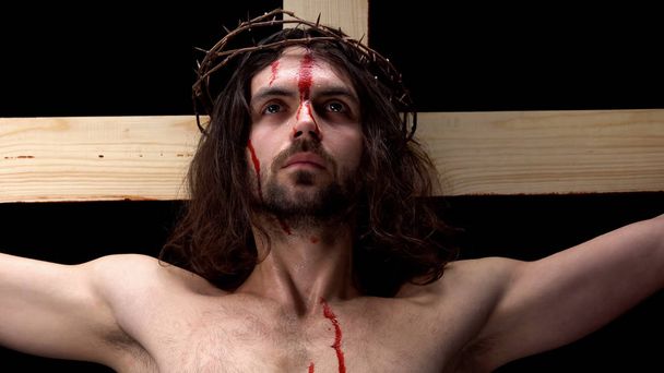 Christian martyr waiting for God coming, tears and blood, forgiveness of sins - 写真・画像
