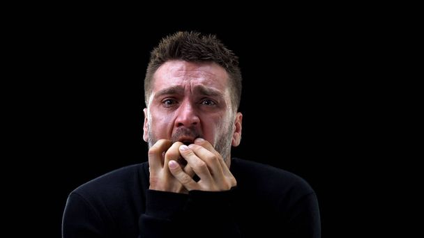 Frightened caucasian man remembering horrible past, psychological trauma, health - Fotó, kép