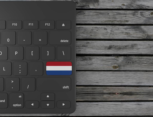 Hollanda bayrağı beyaz klavyede, ahşap arka planda tuş girin. 3d render - Fotoğraf, Görsel