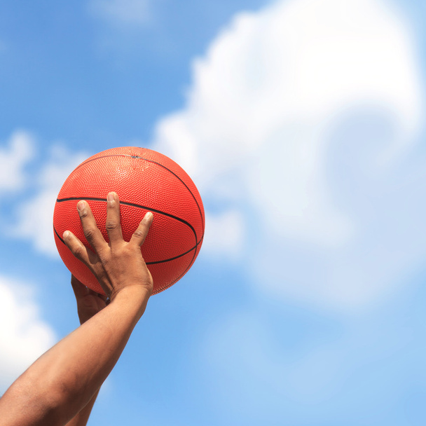 Basketball in hands - Foto, afbeelding