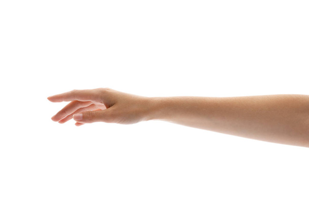 Young woman holding her hand on white background, closeup - Foto, Bild