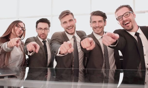 Businessmen in their office pointing to the front - Фото, изображение
